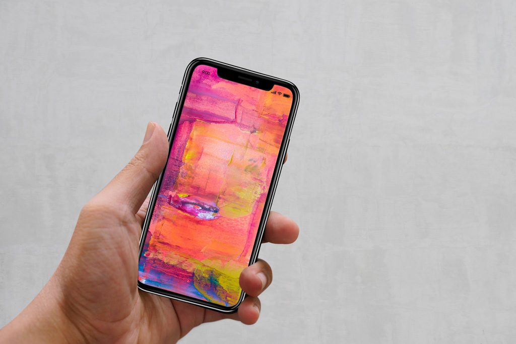1024x683 Male Hand Holding Iphone Xs Mockup Mockupworld