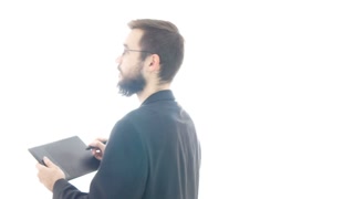 320x180 Bearded Man In Suit Using Drawing Tablet And Walking Around