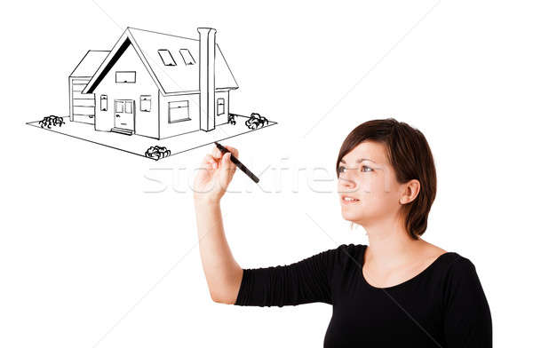 600x392 Young Woman Drawing A House On Whiteboard Stock Photo Rancz