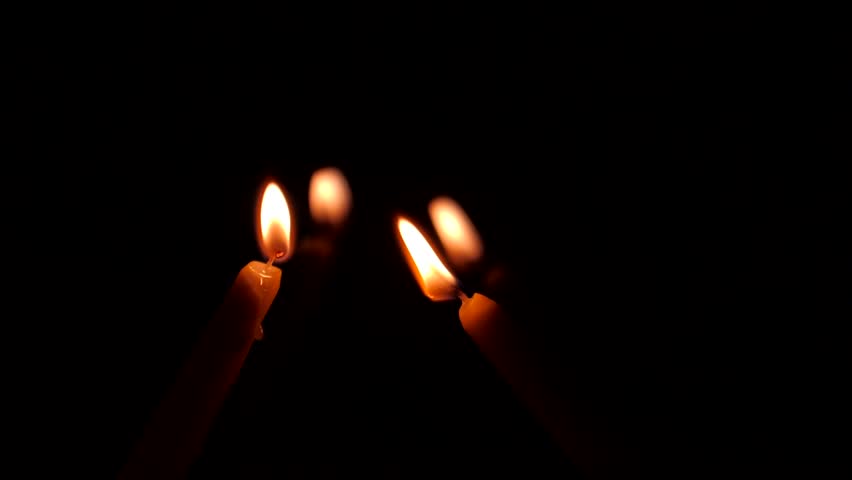 852x480 Moving Single Lit Candle Flame In The Wind On Black Background