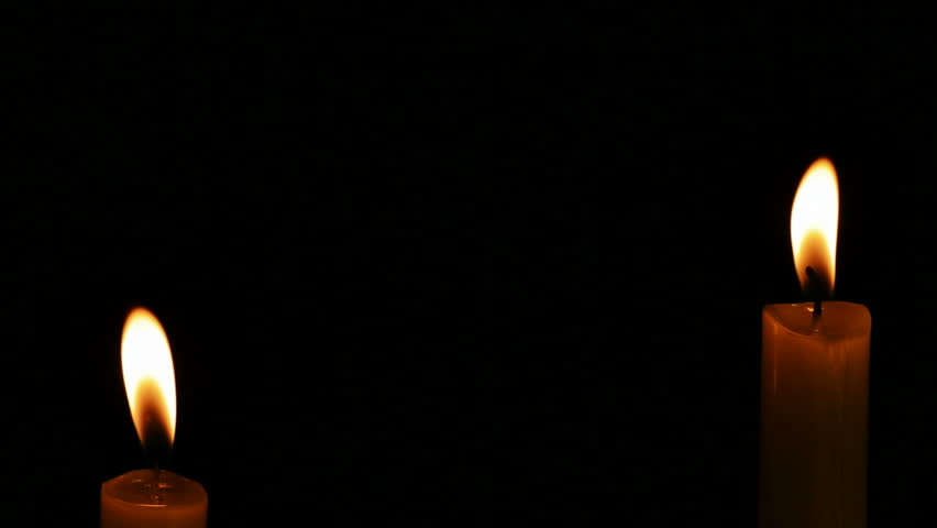 852x480 Red Candle Flame Against A Dark Background With Out Of Focus