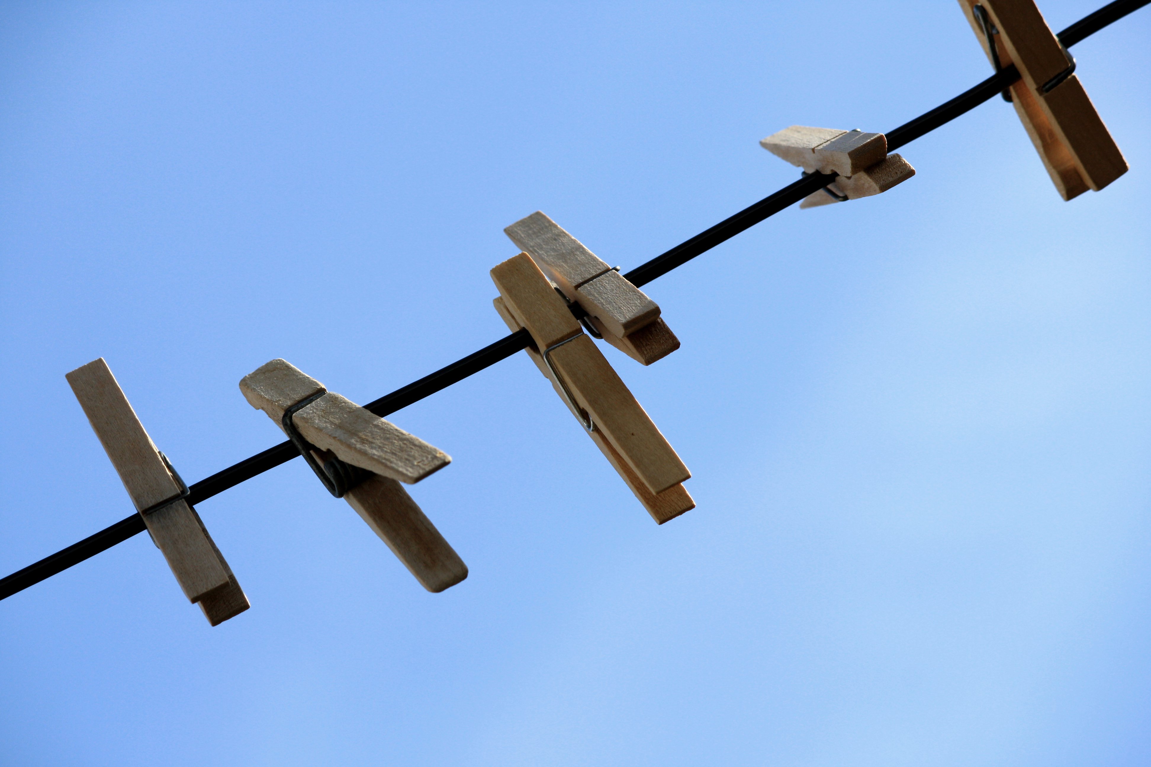 3888x2592 Wooden Clothespins On Clothes Line With Blue Sky In The Background
