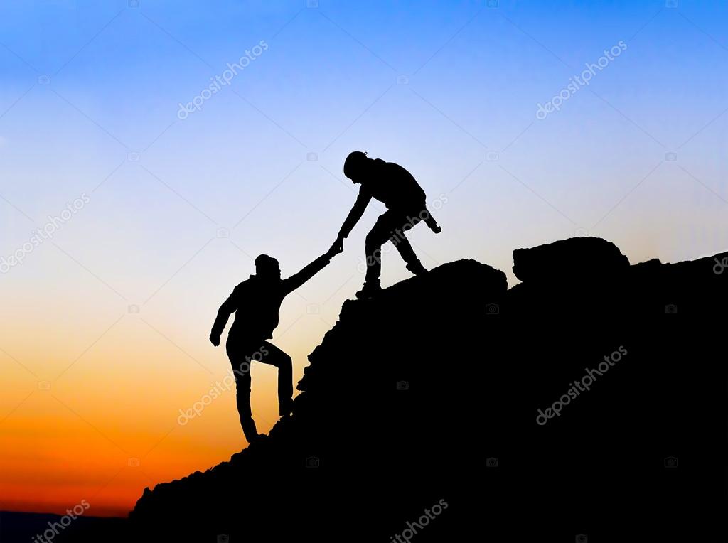1024x764 Silhouette Of Helping Hand Between Two Climber Stock Photo