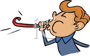 300x188 Young Boy Blowing On A Noisemaker