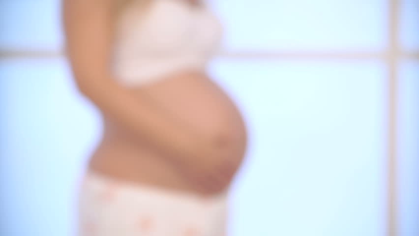 852x480 Doctor Listening To Pregnant Woman's Stomach Stock Footage Video