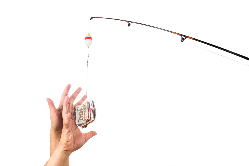 1000x667 Concept Of Hands Reaching For Money Casted As Bait On Fishing Line