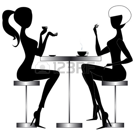 450x450 Two Young Chatting Women Sitting At A Table In A Modern Bar